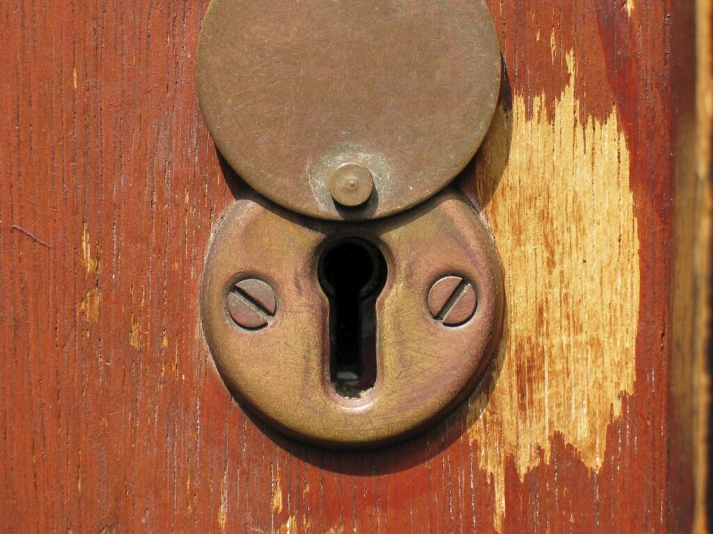 A keyhole with its keyhole cover in the up position