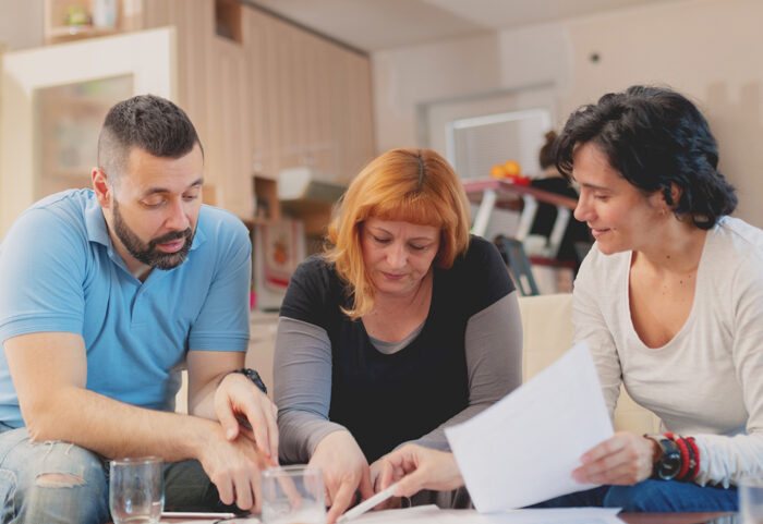 An advisor explains an energy bill to a couple