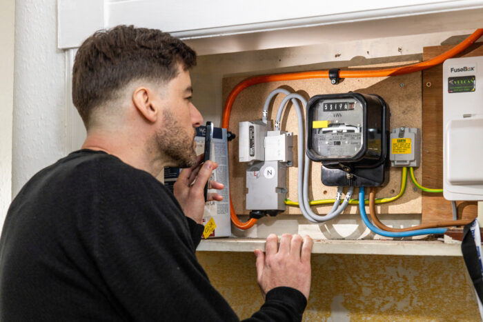 A man reading his gas meter