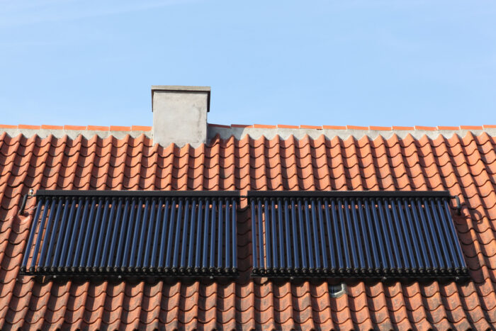 Solar glass tube hot water panel array on a roof