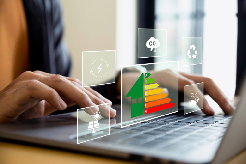 Image of an EPC rating chart and other energy efficiency logos over a computer keyboard