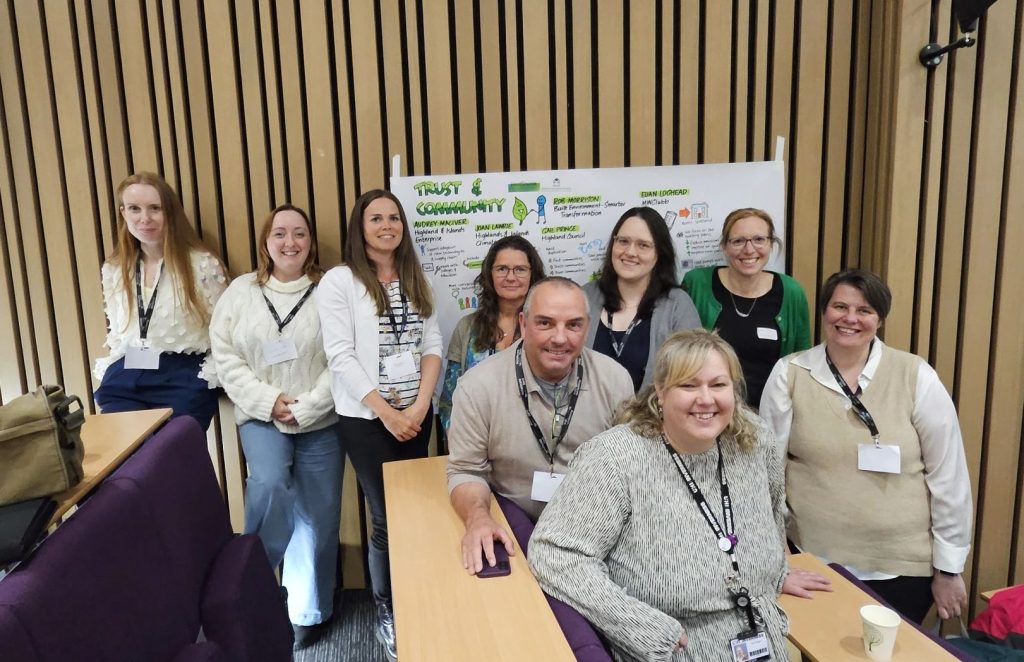 A group of people sitting around tables at the Heat in the Highlands Conference