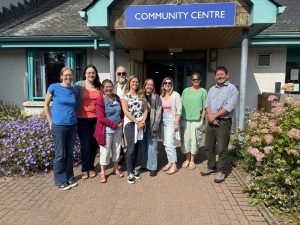 Energy Officers standing outside the Strathpeffer Community Centre.