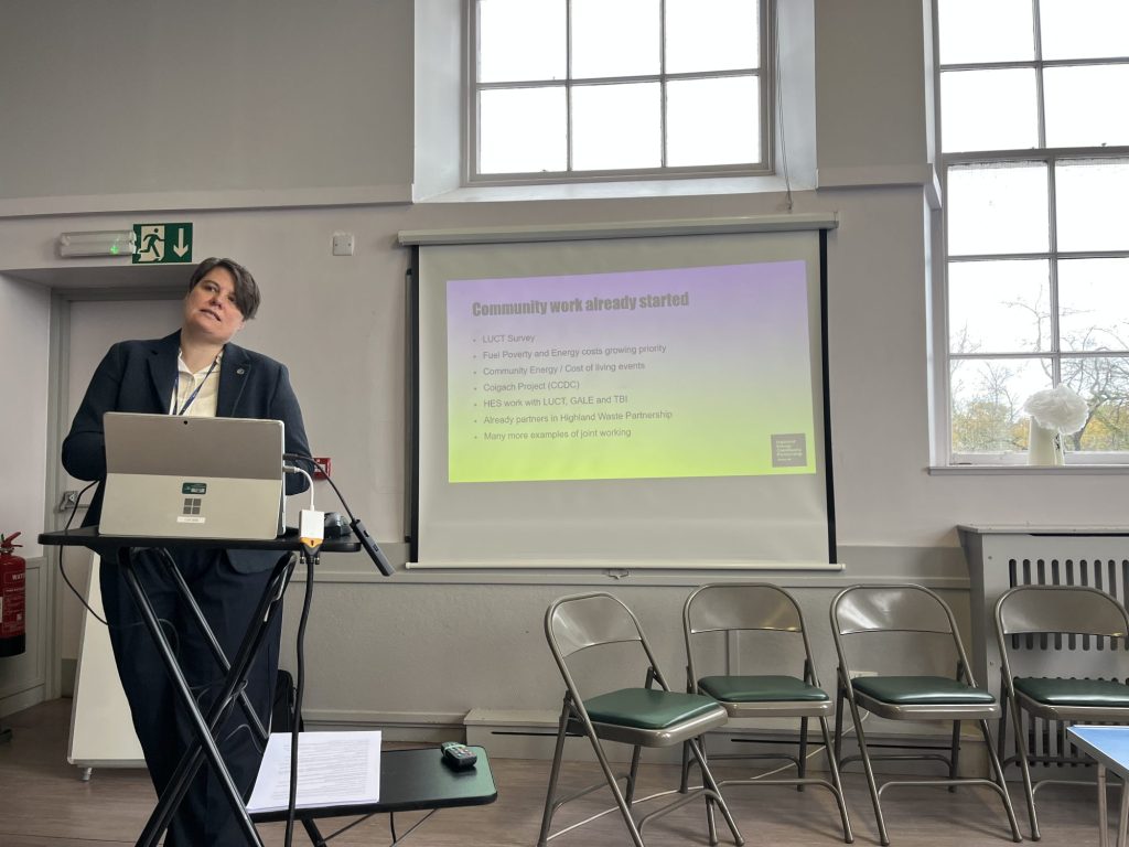 Presenter presenting on the topic of Community work already started