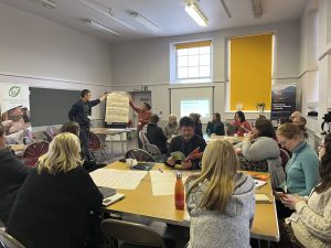 People sitting round tables at the Highland Energy Community Partnership Launch Day